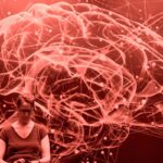 A person sitting reflectively, illustrating the internal struggle of figuring out if they are experiencing anxiety or ocd.